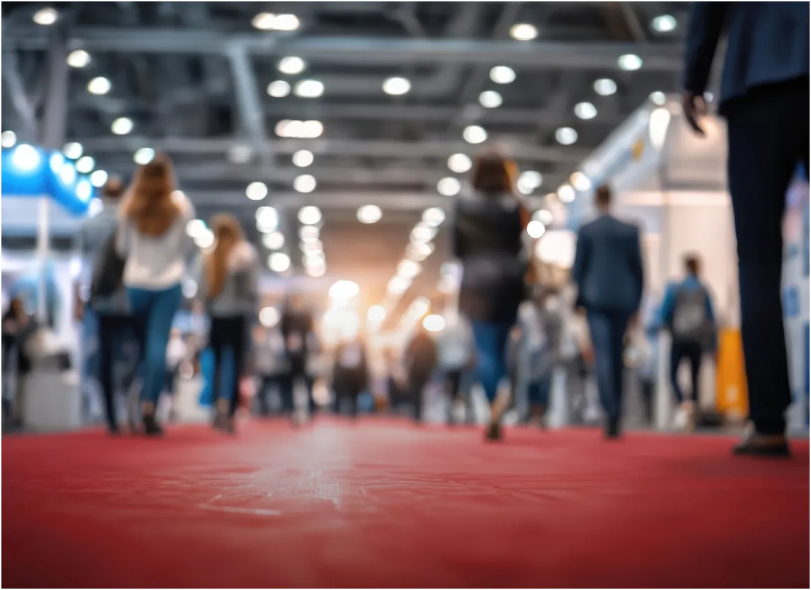 Visitors walking through a trade fair hall