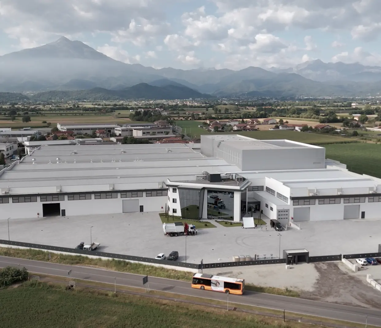 Aerial view of the Nord Engineering plant with the mountains behind