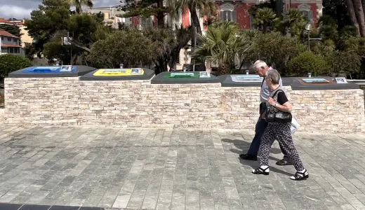 People walking in a square with containers