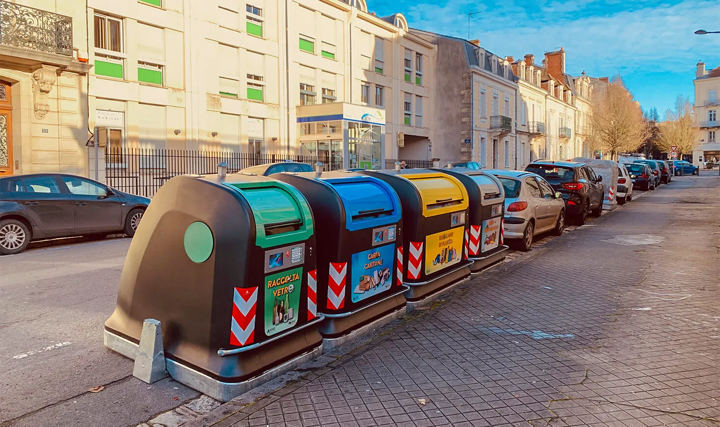 Row of City Next containers along a city street