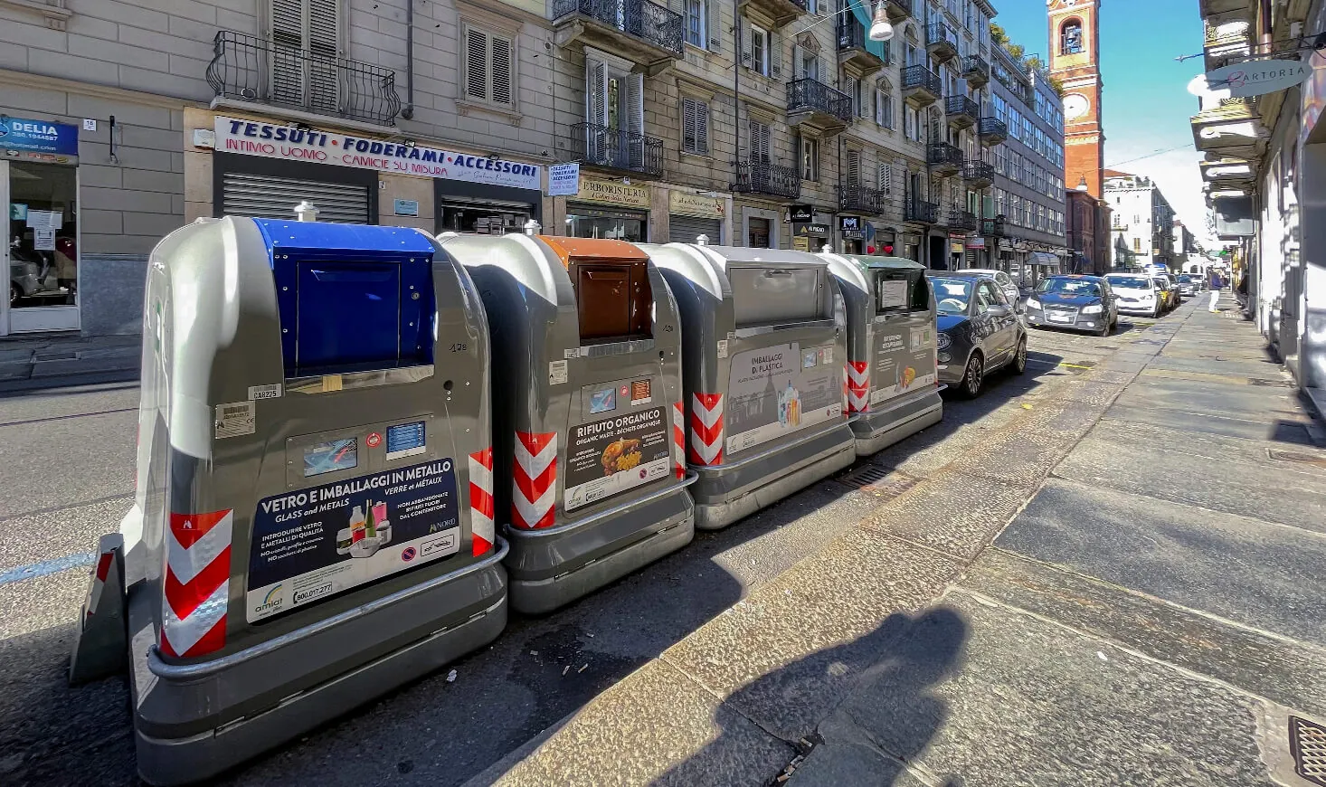 Row of New City Standard containers along a city street