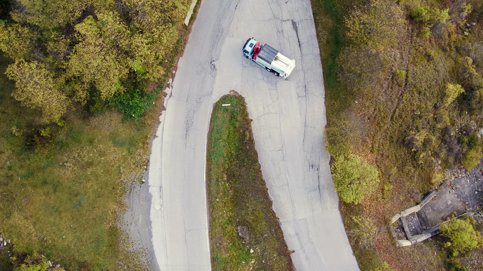 Aerial view of a collection truck on a mountain road