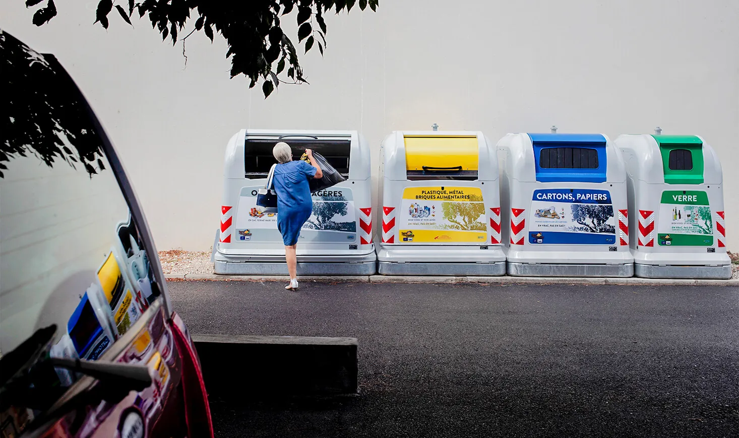 Woman using a New City Standard container