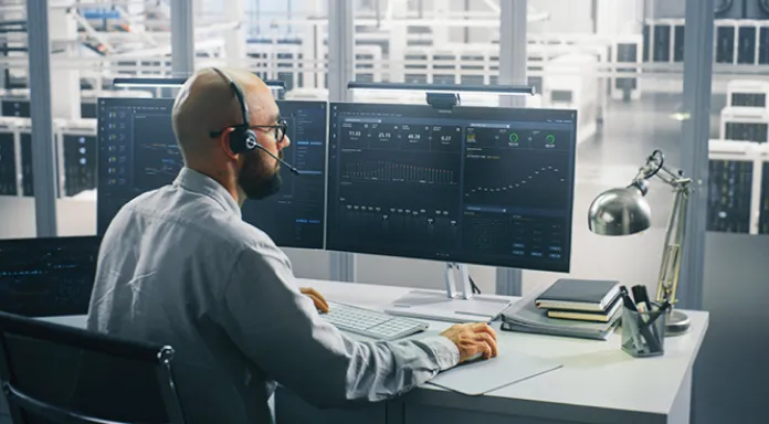 Operator monitoring the collection service on screens in the control room