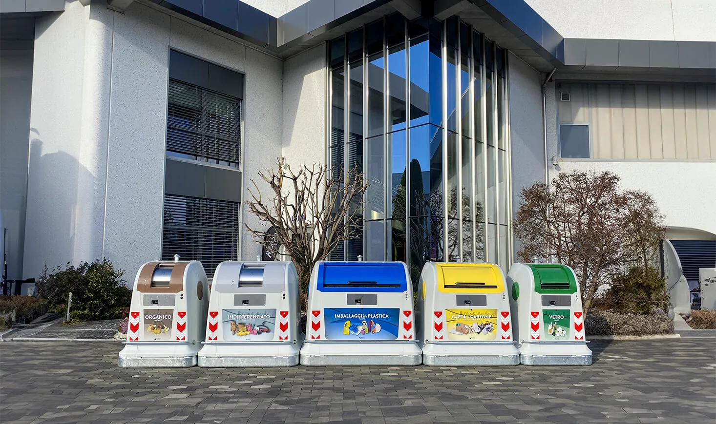 City Next containers in front of a modern building