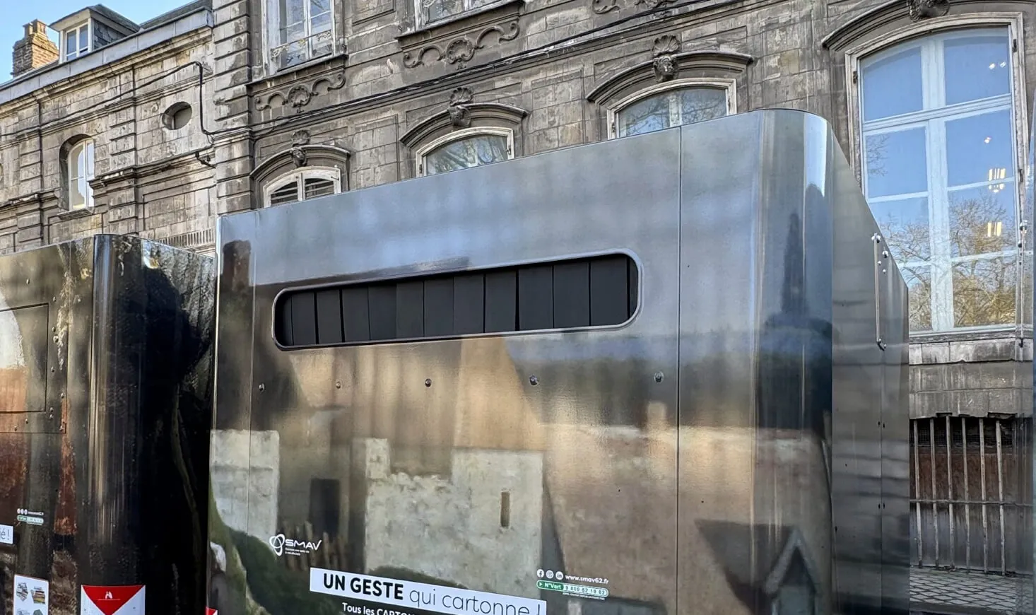 Cube container in front of a historic building in Arras, France