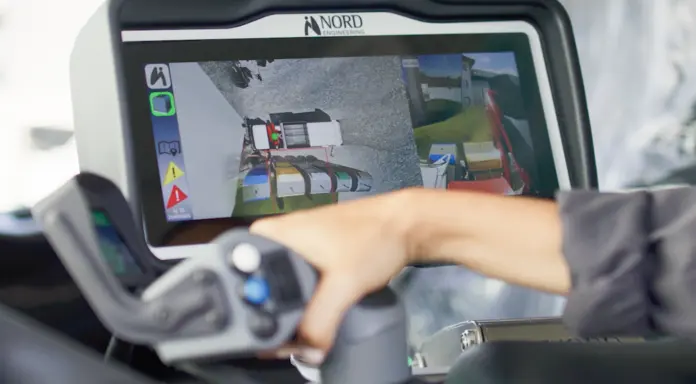 Operator using the EASY System control console from the cab